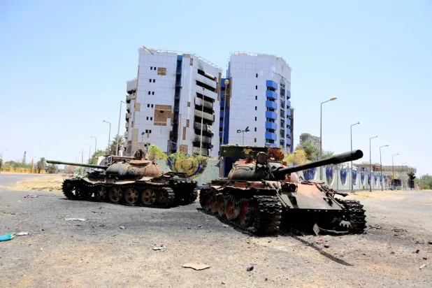 Two damaged tanks outside the central bank building in Khartoum during fighting. File photo: Reuters