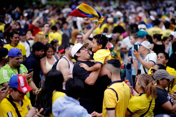Ecuador fans celebrate during a watch party after their team won the 2026 World Cup football tournament match between Ecuador and Germany, at Hudson Yards Backyard in New York City, on June 25, 2026. (Photo by Leonardo MUNOZ / AFP)
