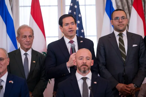 US Secretary of State Marco Rubio, top center, speaks at the start of a signing of a framework agreement, described as a first step toward peace following months of conflict between Israel and the Lebanese group Hezbollah, at the State Department, Friday, June 26, 2026, in Washington. (AP) 