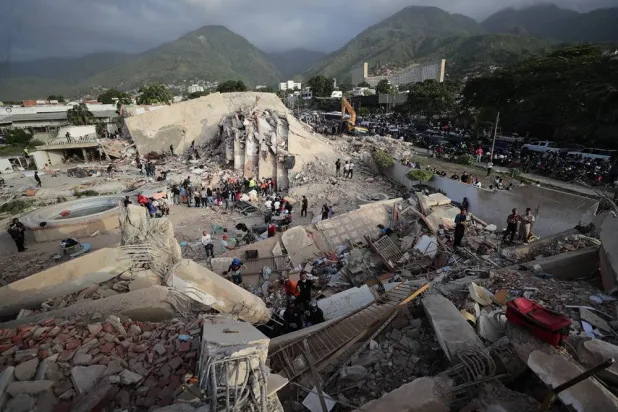 People conduct search operations in an area affected by an earthquake in La Guaira, Venezuela, 26 June 2026. (EPA)
