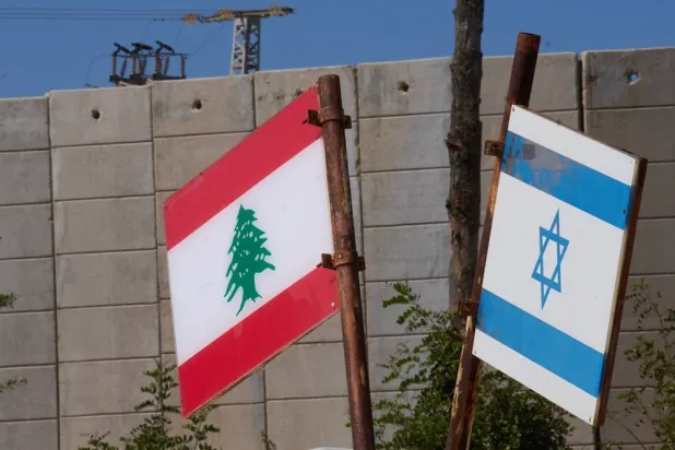  Israeli and Lebanese flags hang in a memorial site on the border with Lebanon in northern Israel, Saturday, June 27, 2026 after Israel and Lebanon sign a framework agreement, described as a first step toward peace following months of conflict between Israel and the Lebanese group Hezbollah. (AP)