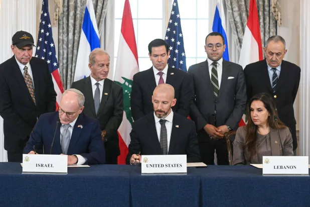 US Secretary of State Marco Rubio (C, back) looks on as (L/R, front row) Israeli Ambassador to the US Yechiel Leiter, State Department Chief of Staff Daniel Holler, and Lebanese Ambassador to the US Nada Hamadeh sign a framework agreement at the US Department of State in Washington, DC, on June 26, 2026. (AFP)