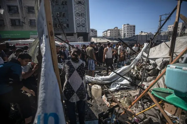 Palestinians inspect their destroyed tents on Al-Jalaa Street following an Israeli airstrike in Gaza City, Gaza Strip, 27 June 2026. (EPA)