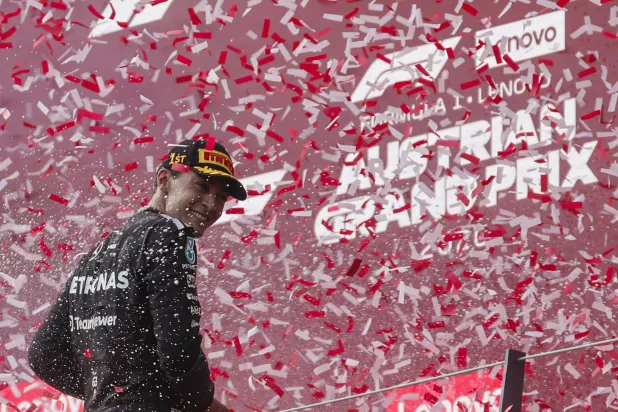 Formula One F1 - Austrian Grand Prix - Red Bull Ring, Spielberg, Austria - June 28, 2026 Mercedes' George Russell celebrates on the podium after winning the Austrian Grand Prix REUTERS/Lisa Leutner