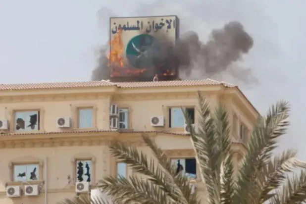 The Muslim Brotherhood headquarters burning in Cairo in summer 2013 (Getty)