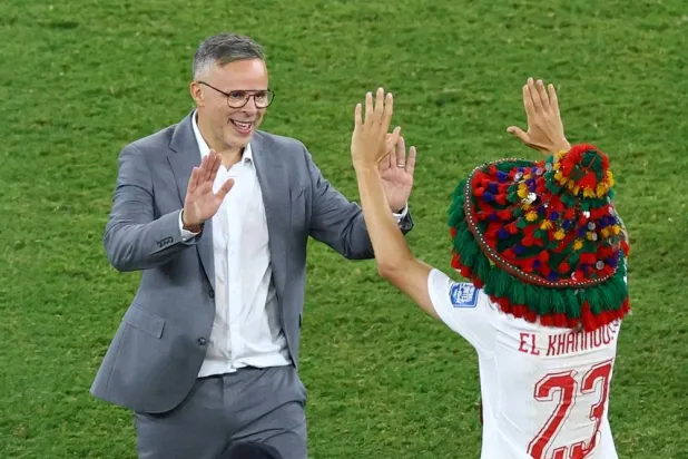Football - FIFA World Cup 2026 - Round of 32 - Netherlands v Morocco - Estadio Monterrey, Monterrey, Mexico - June 29, 2026 Morocco coach Mohamed Ouahbi and Bilal El Khannouss celebrate after the match as Morocco qualify for the round of 16 stage of the World Cup. (Reuters) 