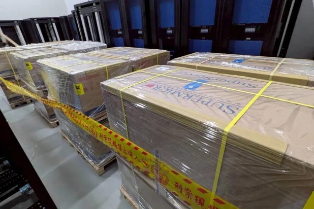 This handout photo from the Taiwan Coast Guard taken on May 20, 2026 and released on May 21 shows pallets of servers made by Super Micro Computer seized by Taiwanese authorities at an undisclosed location. (Photo by Handout / TAIWAN COAST GUARD / AFP) 