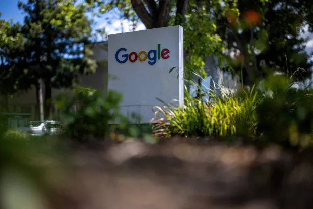 FILE PHOTO: A Google logo is seen at a company research facility in Mountain View, California, US, May 13, 2025. REUTERS/Carlos Barria/File Photo