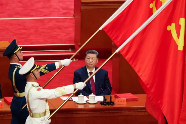 Chinese President Xi Jinping looks on as People’s Liberation Army honor guard hold party flags during a ceremony marking the 105th anniversary of the founding of the Communist Party of China at the Great Hall of the People in Beijing, China, July 1, 2026. (Reuters)