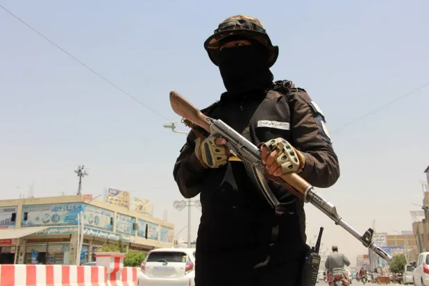 Taliban security officials stand guard on a street in Kandahar, Afghanistan, 30 June 2026. (EPA)