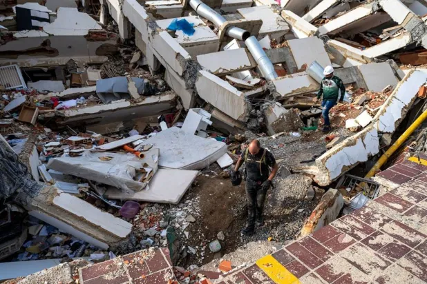 Volunteers and rescuers help to find survivors in a collapsed building in Caraballeda, La Guaira state, Venezuela, on June 30, 2026, following the June 24 twin earthquakes. (Reuters)