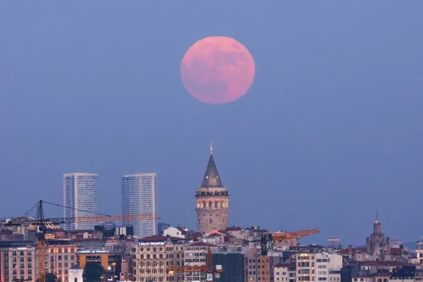  A full moon rises over the Galata Tower in Istanbul, Türkiye, June 29, 2026. (Reuters)