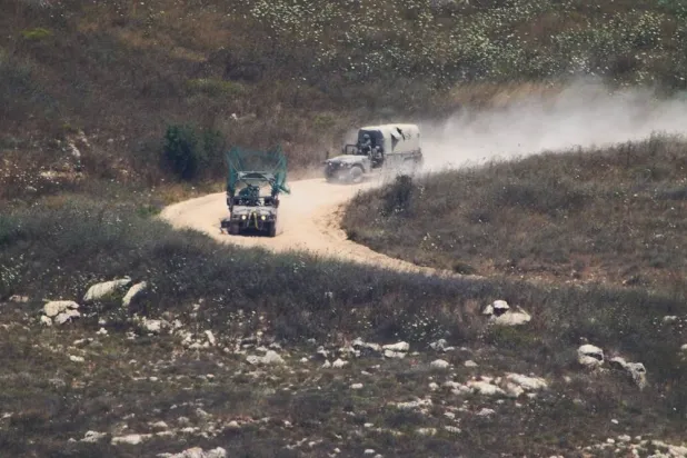  Israeli soldiers drive in southern Lebanon as seen from northern Israel, Wednesday, July 1, 2026. (AP) 