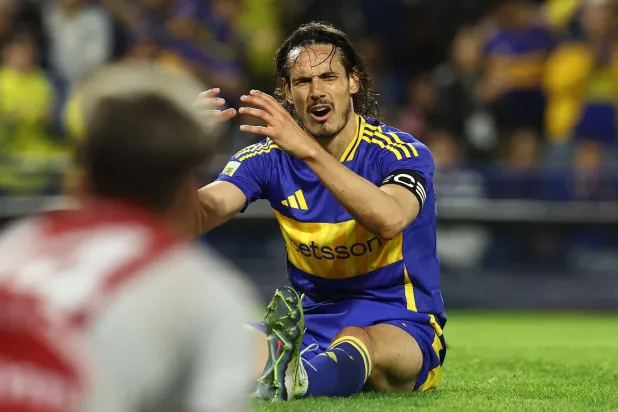 (FILES) Boca Juniors' Uruguayan forward Edinson Cavani reacts after failing to score during the 2024 Argentine Professional Football League tournament match between Boca Juniors and Argentino Juniors at the Alberto Jose Armando 'La Bombonera' Stadium in Buenos Aires on October 6, 2024. (Photo by ALEJANDRO PAGNI / AFP)