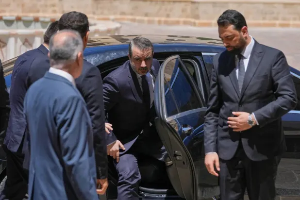  Syrian Foreign Minister Asaad al-Shibani arrives at the government palace in Beirut. (AP)