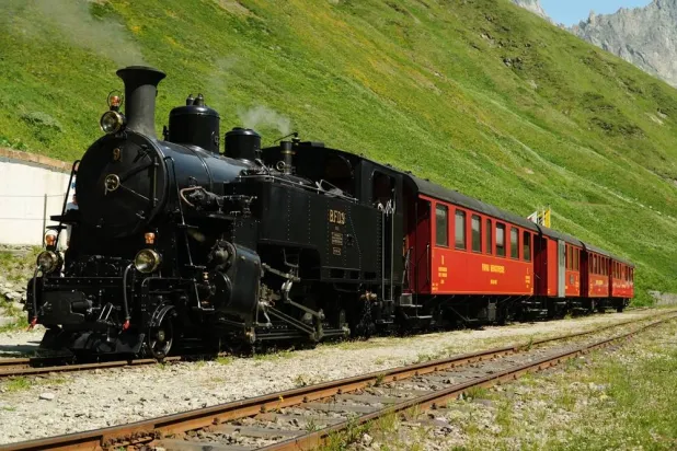  One of DFB's historic steam trains travels from Realp to Oberwald during a stop at the Furka station, Switzerland, Friday, June 26, 2026. (AP) 