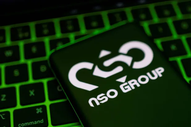 Logo of Israel's NSO Group, owner of the Pegasus spyware, on a smartphone placed on a keyboard. (Reuters)