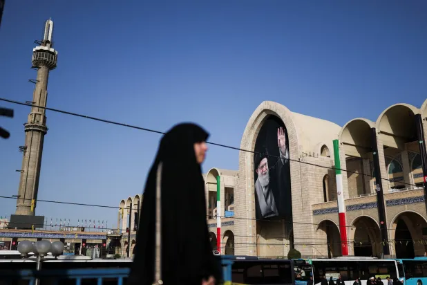 A woman walks at the Imam Khomeini Grand Mosalla on the day International delegates participate in a farewell ceremony for Iran's late Supreme Leader Ali Khamenei, who was killed on February 28 during Israeli and US airstrikes on Iran, in Tehran, Iran July 3, 2026. (Reuters)