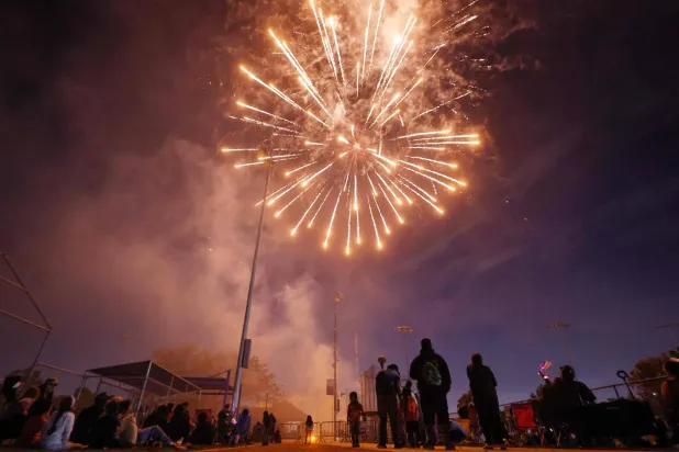 LYNWOOD, CALIFORNIA - JULY 03: People watch fireworks explode during the annual Independence Day Celebration in the predominantly Latino community of Lynwood on July 3, 2026 in Lynwood, California. Mario Tama/Getty Images/AFP