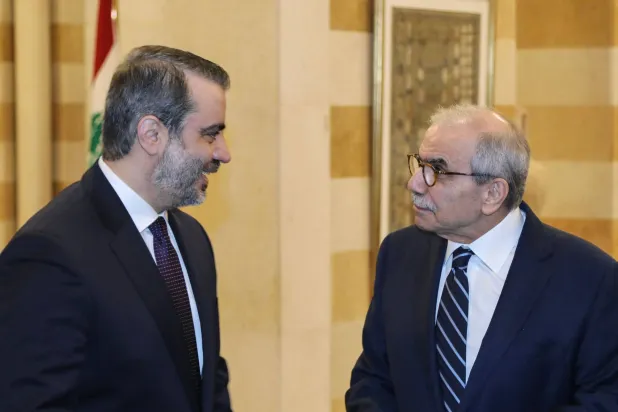 This handout photograph released by the Lebanese Government Press Office shows Lebanon's Prime Minister Nawaf Salam (R) meeting with Syria's Foreign Minister Asaad al-Shaibani at the governmental palace in Beirut on July 2, 2026. (Lebanese Government Press Office / AFP) 