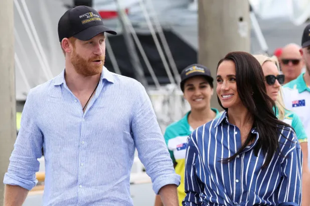 FILE PHOTO: Britain's Prince Harry and Meghan, the Duke and Duchess of Sussex, arrive at Rushcutters Bay following a sail on Sydney Harbour with veterans from the Invictus Australia community, in Sydney, Australia, April 17, 2026. REUTERS/Hollie Adams/File Photo