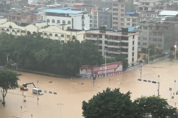 Floodwater flows down the side of a ramp at a construction site, amid heavy rain brought by Typhoon Maysak, in Guigang, Guangxi Zhuang Autonomous Region, China, in this still image obtained from social media video. (Social Media/via Reuters)