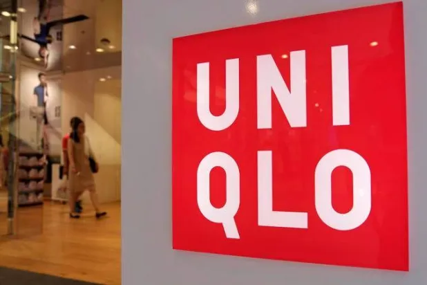 Shoppers walk inside Fast Retailing's Uniqlo casual clothing store in Tokyo, Japan July 10, 2014. REUTERS/Toru Hanai/File Photo