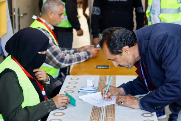 A Palestinian man votes during the municipal election at a polling station in Deir al-Balah, central Gaza Strip April 25, 2026. REUTERS/Mahmoud Issa