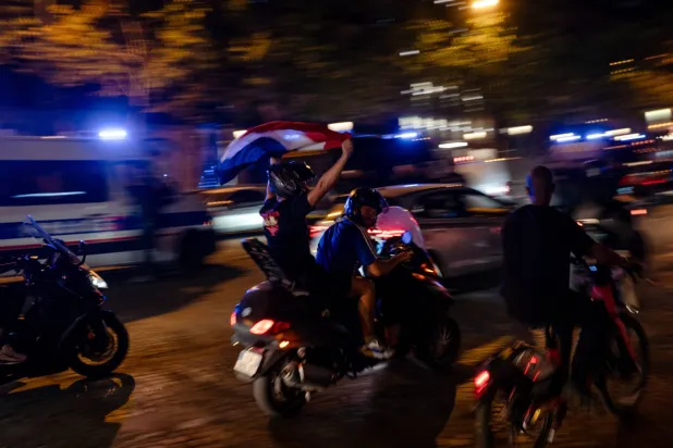 French fans celebrate their team on the Champs-Elysees avenue in Paris, France, after winning the 2026 FIFA World Cup quarterfinal match against Morocco, 10 July 2026.  EPA/Fadi Yousef