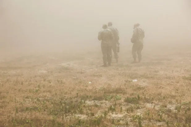 US military officials are enveloped in a dust cloud created by the rotor wash of a landing MV-22 Osprey aircraft during the Rim of the Pacific (RIMPAC) military exercises at Marine Corps Training Area Bellows (MCTAB) in Waimanalo, Hawaii, US, July 9, 2026. REUTERS/Marco Garcia