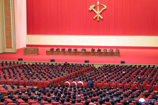 This picture taken on July 10, 2026 and released by North Korea's official Korean Central News Agency (KCNA) on July 11, 2026 shows North Korean leader Kim Jong Un (C) attending a joint meeting of party, government and army of North Korea at the April 25 House of Culture in Pyongyang. (KCNA via KNS / AFP)