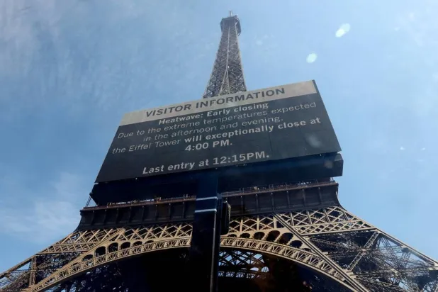  A sign informs visitors that the Eiffel Tower will close at 16:00 CEST today due to extreme temperatures during a heatwave in Paris, France, July 11, 2026. (Reuters)