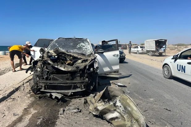 11 July 2026, Palestinian Territories, Nuseirat: A vehicle damaged in an Israeli strike is seen at the scene in the Nuseirat refugee camp in the central Gaza Strip, where a Palestinian was killed and others were wounded. (dpa)