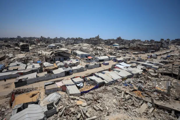 Displaced Palestinians shelter in tents near the rubble of buildings destroyed during the Israeli offensive, in Gaza City, July 6, 2026. REUTERS/Dawoud Abu Alkas