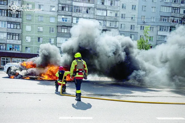 Firefighters work at a site of a Russian air strike, amid Russia's attack on Ukraine, in Sumy, Ukraine in this handout picture released July 11, 2026. Press service of the State Emergency Service of Ukraine in Sumy region/Handout via REUTERS  