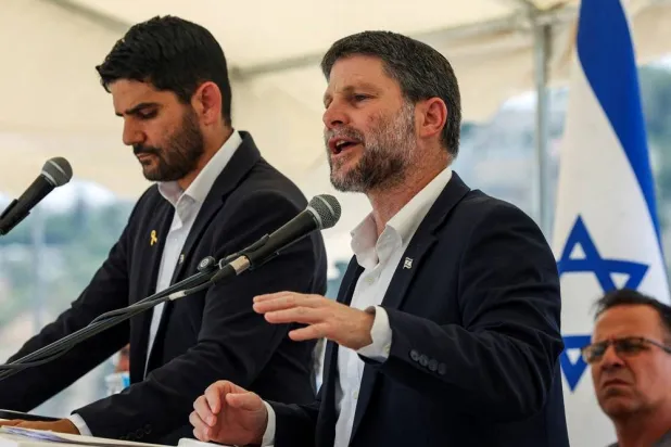Israeli Finance Minister Bezalel Smotrich speaks at a press conference regarding settlements expansion for the long-frozen E1 settlement, that would split East Jerusalem from the occupied West Bank, near the Israeli settlement of Maale Adumim in the Israeli-occupied West Bank, August 14, 2025. (Reuters)