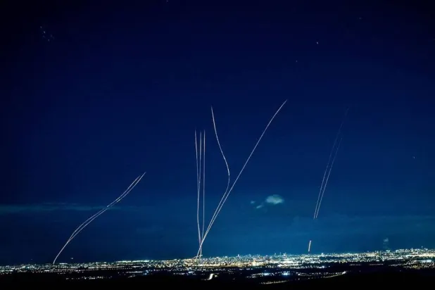 Interceptors rise into the sky after Iran launched missiles into Israel, as seen from central Israel, February 28, 2026. (Reuters)