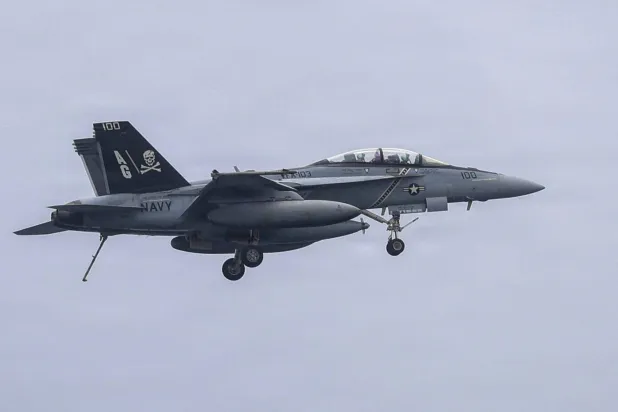This US Navy handout photo released on July 10, 2026 and taken on June 29 by US Central Command Public Affairs shows an F/A-18F Super Hornet, attached to Strike Fighter Squadron (VFA) 103, preparing to land on the flight deck of Nimitz-class aircraft carrier USS George H.W. Bush (CVN 77). (US Navy/AFP)