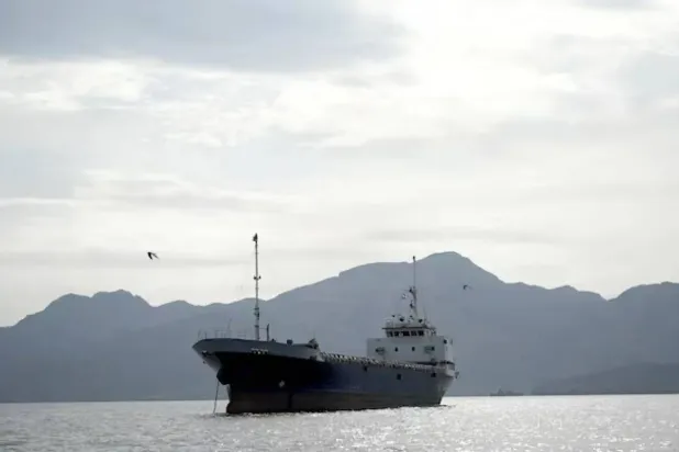  A ship crosses the Strait of Hormuz off Oman’s Musandam governorate on April 12. REUTERS 