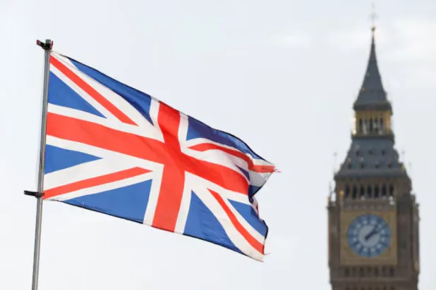 The Britain's national flag flies next to the Elizabeth Tower, commonly known as Big Ben, in London, Britain, March 23, 2022. REUTERS/Peter Cziborra/ File Photo 