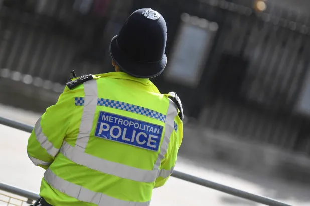 A Metropolitan Police officer stands on duty in Westminster, London, Britain, October 1, 2021. (Reuters)