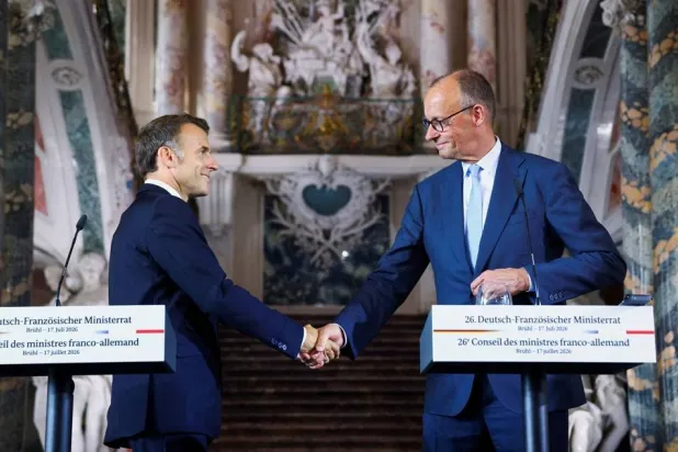  German Chancellor Friedrich Merz and French President Emmanuel Macron shake hands after a press conference at Schloss Augustusburg in Bruehl, Germany, July 17, 2026. (Reuters)