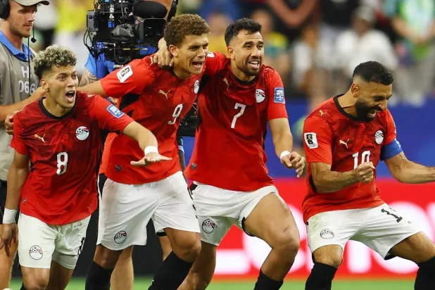 Egypt's Mohamed Salah and teammates celebrate after Hossam Abdelmaguid scored the penalty past Australia's Mathew Ryan to win the shootout and advance to the Round of 16 of the World Cup. (Reuters) 