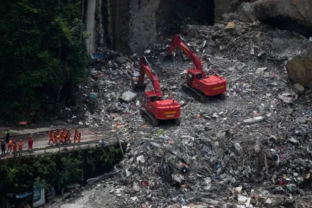 Rescuers work at the scene of a landslide in Pengshui County, southwestern China's Chongqing on Sunday, July 19, 2026. (AP)
