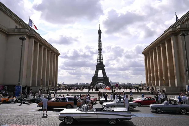 Participants park their car at the Trocadero, with the Eiffel Tower seen in the background, during the 19th Summer parade of vintage vehicles in Paris on July 19, 2026. (AFP)