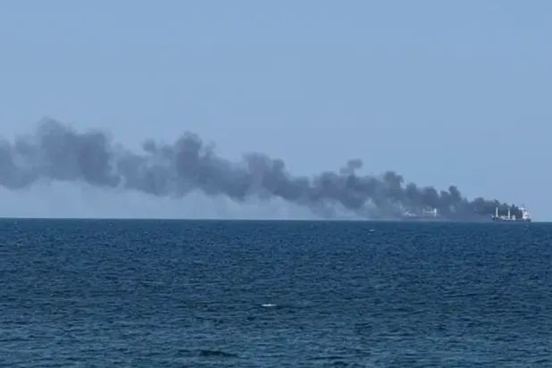 Smoke rises from a civilian vessel on fire, amid Russia's attack on Ukraine, in Odesa, Ukraine July 19, 2026.Picture taken with a mobile phone. (Reuters)
