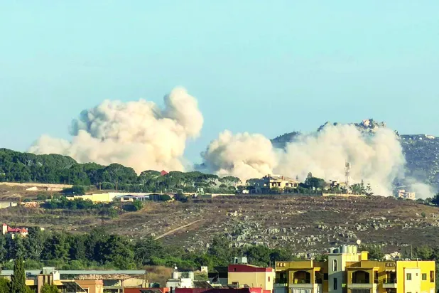 Smoke rises following Israeli controlled-explosions in the village of Kfar Tibnit as seen from Nabatieh in southern Lebanon on July 18, 2026 (Photo by Abbas Fakih / AFP) / 