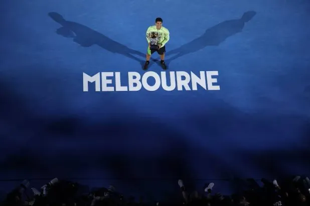 
Tennis - Australian Open - Melbourne Park, Melbourne, Australia - February 1, 2026 Spain's Carlos Alcaraz celebrates with the trophy after winning the Australian Open men's singles against Serbia's Novak Djokovic. REUTERS/Hollie Adams 
