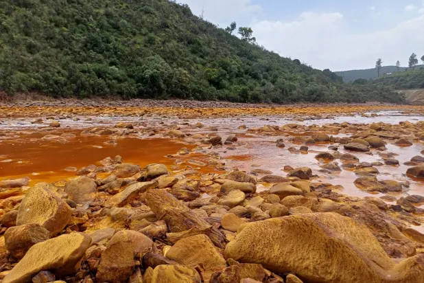 This undated handout photo obtained on July 21, 2026, from Luke Bridgestock of the University of St Andrews shows a view of the Tinto River, with pollution from acid mine drainage, in the Iberian Pyrite Belt in southwest Spain. (Luke Bridgestock / University of St Andrews / AFP)