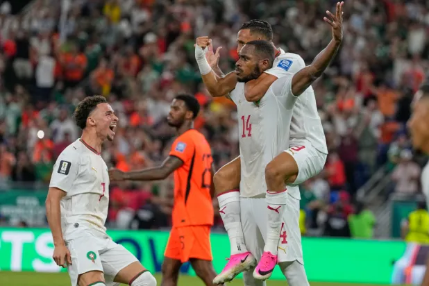 Morocco's Issa Diop is congratulated by teammates Soufiane Rahimi (9) and Chemsdine Talbi, left, after he scored his team's first goal during the World Cup round of 32 soccer match between the Netherlands and Morocco in Guadalupe, near Monterrey, Mexico, Monday, June 29, 2026. (AP Photo/Ricardo Mazalan)